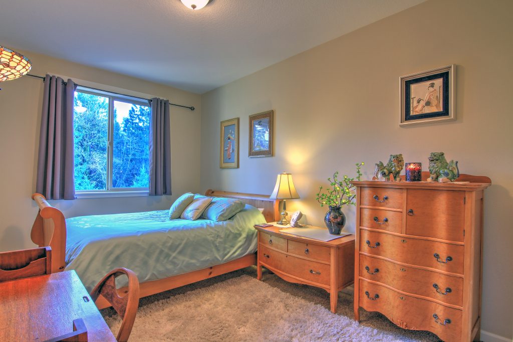 First floor bedroom with antique furniture.